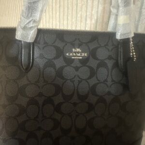 Brand new Coach bag purchased in November as a Christmas gift to myself .